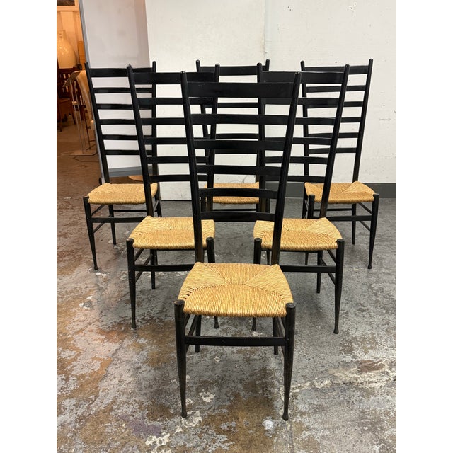 Design Plus Gallery presents a Set of Six Vintage Gio Ponti Style Italian Ladder Back Dining Chairs. This set includes six...