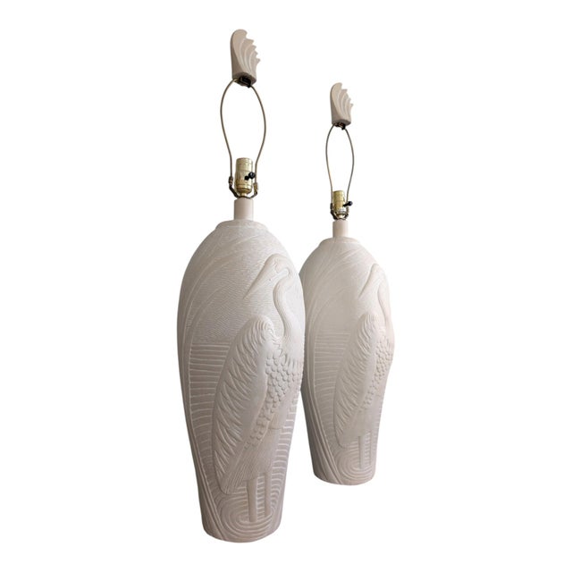 A striking vintage pair of sculptural table lamps by Dayle Rushall, featuring raised heron/egret designs against textured...