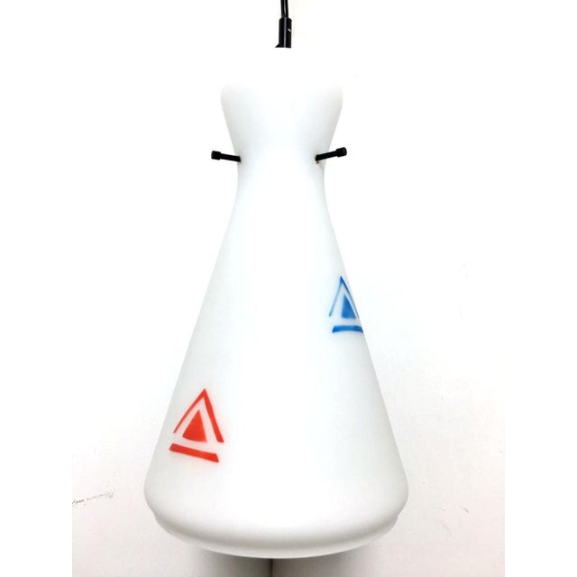 Ceiling chandelier in colored opaline glass. The chandelier is Italian-made from the 1960s, completely sanitized and...