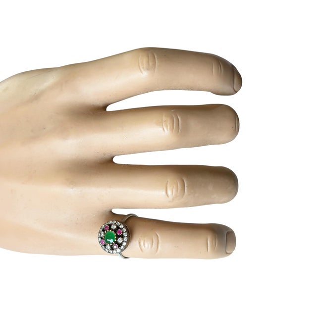 This fabulous vintage hand-made sterling silver statement ring from Jaipur, India features ruby, emerald, and sparkling...