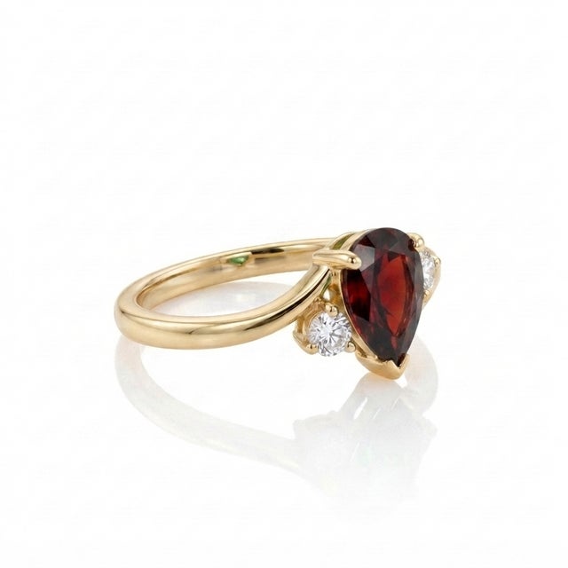 Embrace timeless grace with this exquisitely designed pear-cut bypass ring. Captivating and sophisticated, this piece...
