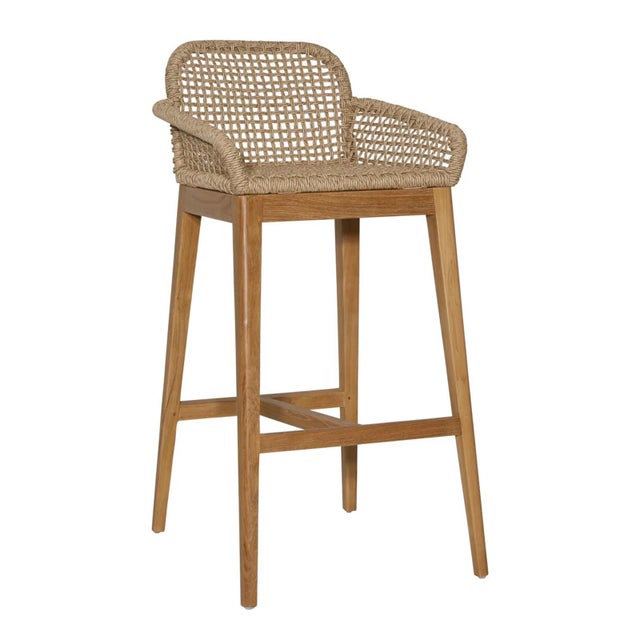 Teak wood frame bar stool with durable basket woven faux wicker seat, back, and arms. Each may vary in natural coloring...