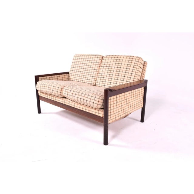This sofa was designed in the style of Illum Wikkelso.