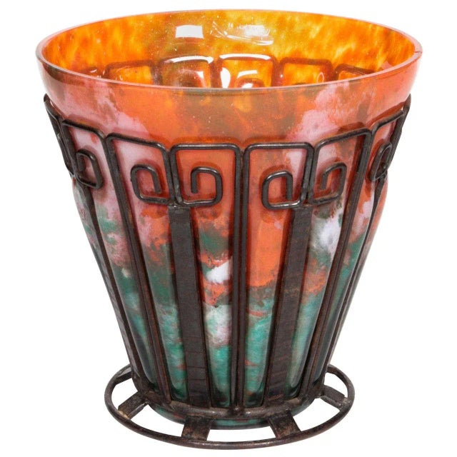 A fine Lorrain Nancy, School of Nancy original, hand-hammered iron framed vase with handblown mottled glass inset in...