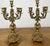 An elegant pair of Vintage brass candelabras featuring beautifully ornate five-arm candle holders with richly decorative...