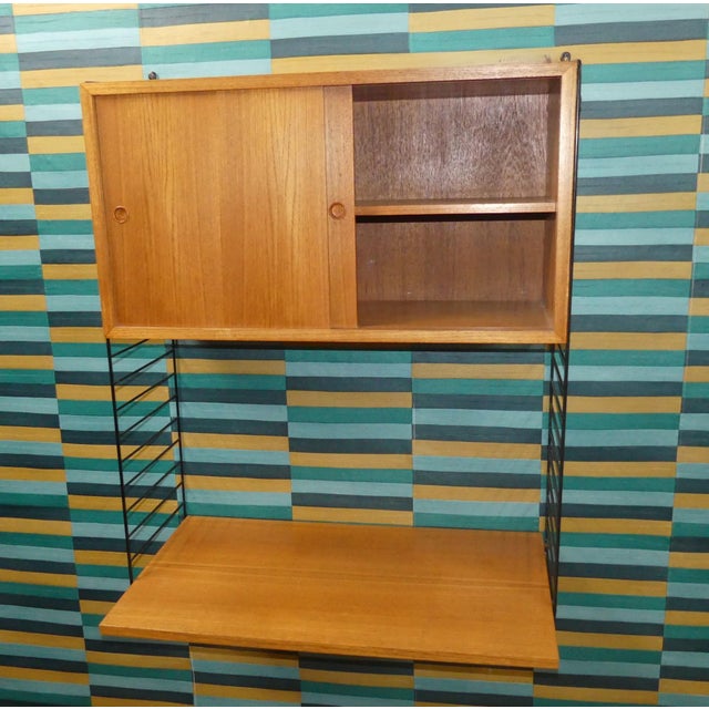 An absolute classic! Simple, Swedish design Design classic Nisse Strinning designed his famous shelving system in 1949. It...
