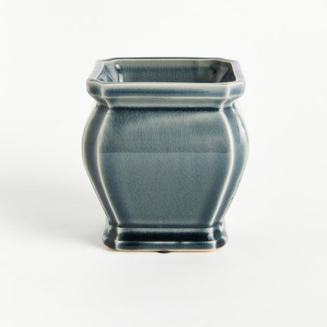 In a traditional coveted silhouette, this pot has a regal charm. Finished with a rich, blue reactive glaze, it is a...