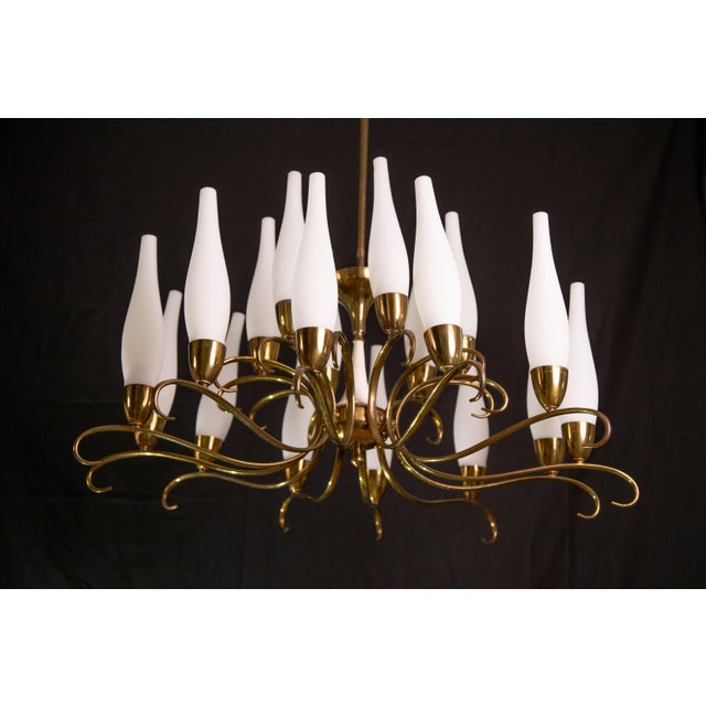 Exceptional 18-light stilnovo chandelier made of brass and opaline glass. Period: 1950s Good vintage condition, few signs...