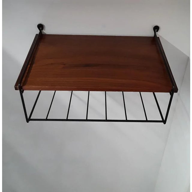 Small Mid-Century Minimalist Teak Wall Shelf with Black Wire Frame, 1960s, in Good conditions. Designed 1960 to 1969
