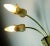 Very rare and unusual 2-arm wall lamp from the 50s. From beige, pastel yellow and gold-colored ceramic and brass. For 2...