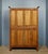 A Louis XV style bookcase in walnut, oak, and beech, circa 1880. The front features two glazed doors with wooden bases,...