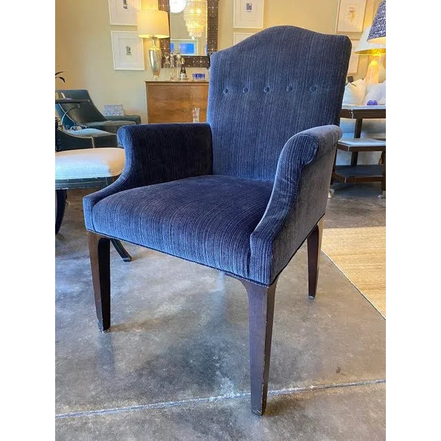 This is the Trevor armchair by Century Furniture. The upholstery on the chair is a navy blue velvet. The seat back...