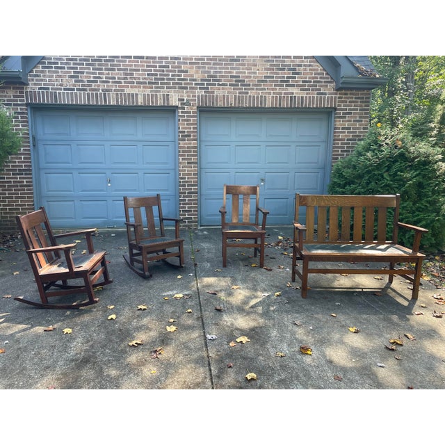Stickley style seating for 5. Includes 4 pieces: A 2 seater bench, a pair of rocking chairs and a single chair. Handsome...