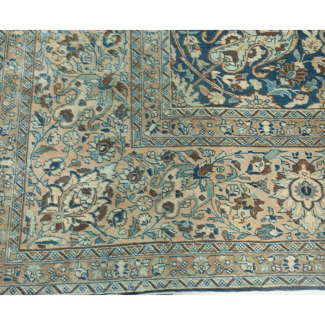 An early 20th century Northwest Persian Tabriz antique rug, the royal blue field with an allover trellis of enlarged...