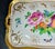Hand painted porcelain serving tray featuring a central floral bouquet in vibrant colors of pink, orange, and blue with...