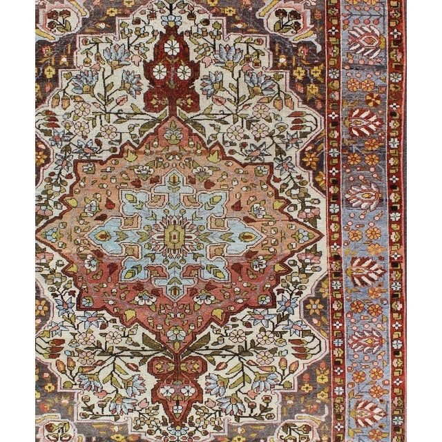 Measures: 4'7 x 6'4. Persian Bakhtiari Rug with Central Medallion and Multicolor Botanical Motifs. Keivan Woven Arts / rug...