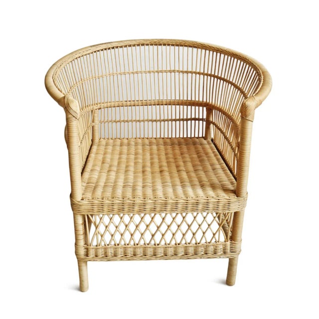 Hand woven raw wicker horseshoe chair. Okay for outdoor use under covered area. Each chair may vary in natural tones and...