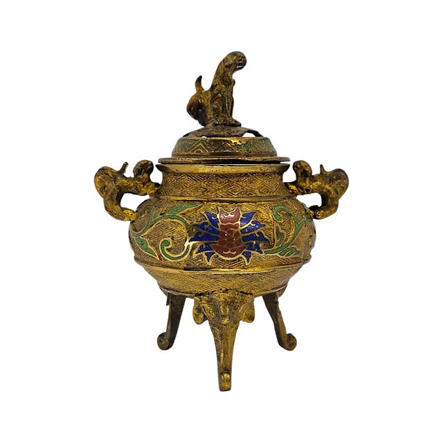 A mid-twentieth-century Japanese covered incense burner or censer, cast in brass/bronze-alloy metal and richly decorated...