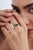 This heart cluster ring features 1.34 carats of vibrant green heart-cut emeralds, set in 14K yellow gold. The twin center...
