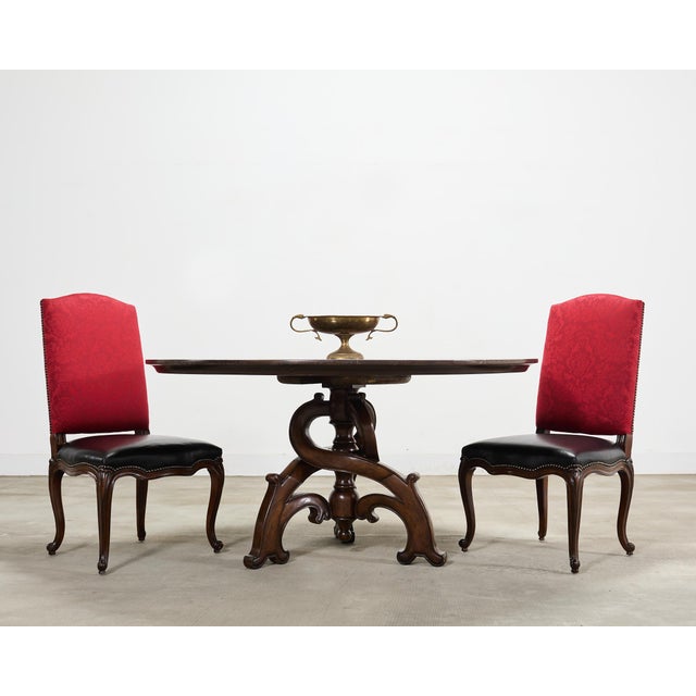 A handsome bespoke set of ten signed Ralph Lauren Home “Noble Estate” dining side chairs, executed in a dramatic...