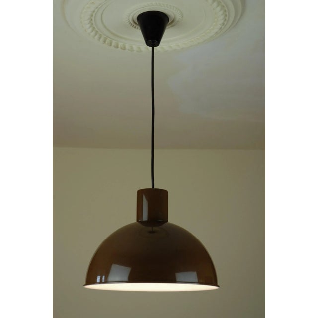 This Midi Bunker pendant lamp was designed by Johannes Hammerborg in the 1970s and produced in three different sizes. This...
