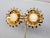 Late 1960s or early 1970s goldtone cabochon yellow resin flower clip earrings. Marked "NAPIER PAT. PEND." on the clips and...