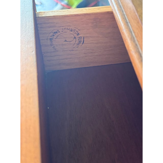 Designed by Renzo Rutili for Johnson Furniture Company (Grand Rapids, Michigan), this 9-drawer dresser is a refined...