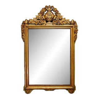 Antique Early Period Baker Carved Giltwood Neoclassical Wall Mirror With Flowers, Leaves and Acorns For Sale