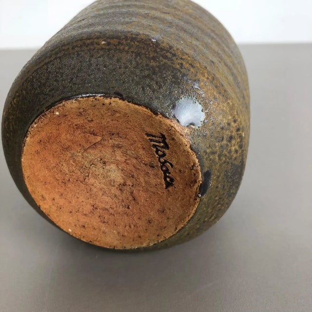 This original vintage studio pottery vase was produced in the 1960s by Piet Knepper for Mobach in Utrecht, Netherlands. It...