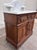 This is a gorgeous antique Victorian walnut marble-top washstand, circa 1870–1885, featuring an arched white marble...