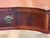 19th century English mahogany server with a shaped front that curves inward at the center and bows out at each end. Three...