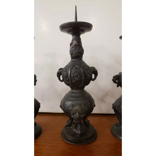 This is a Set of 3 Late 19th Century Japanese Bronze Pricket Buddhist Temple Candlesticks (Meiji Period). The middle one...