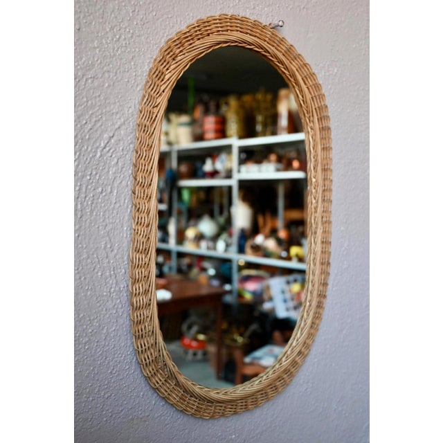 with its delicate wickerwork and soft rattan, this vintage oval mirror exudes charm. Whether displayed alone or as part of...