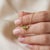 Add a touch of vibrant freshness to your jewelry collection with this romantic three-stone pendant necklace, featuring...