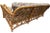 Description Coastal Classic three-seat rattan sofa featuring a warm honey-toned natural rattan frame with curved double-...