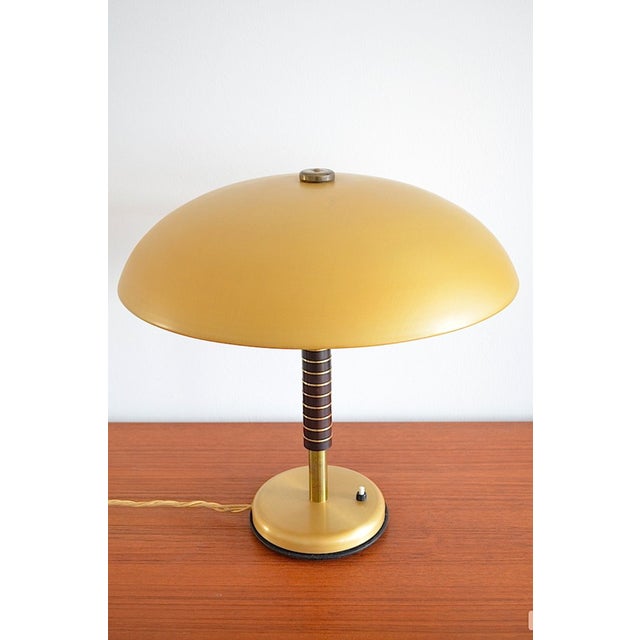 Art Deco desk lamp - The lamp is made of anodized aluminum and brass. - The lamp stem consists of 10 Bakelite pieces...