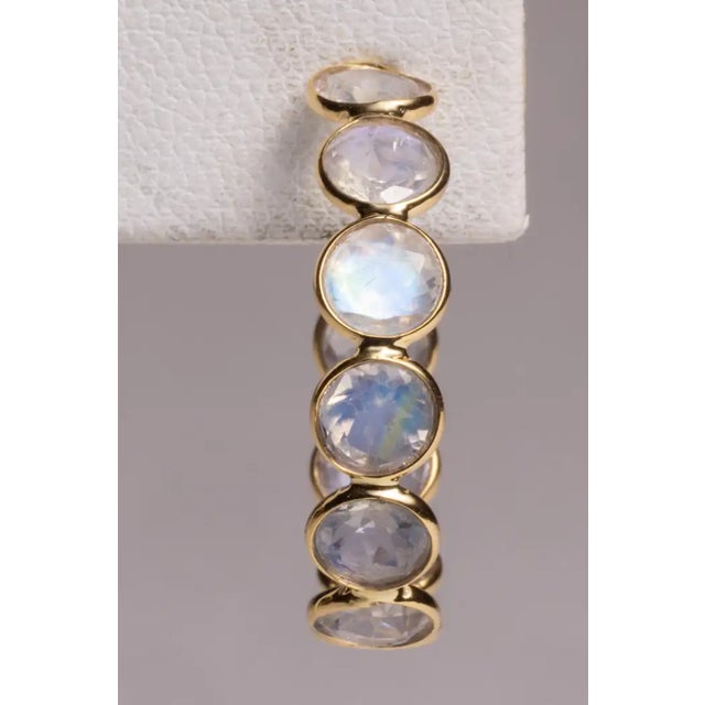A fabulous pair of 18K gold hoops with 10 faceted, round rainbow moonstones on each earring. Post for pierced ears....