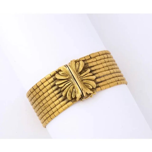 This Elegant Italian bracelet has a Brushed finish, a box clasp, and a figure 8 safety. The clasp is marked 750, and the...