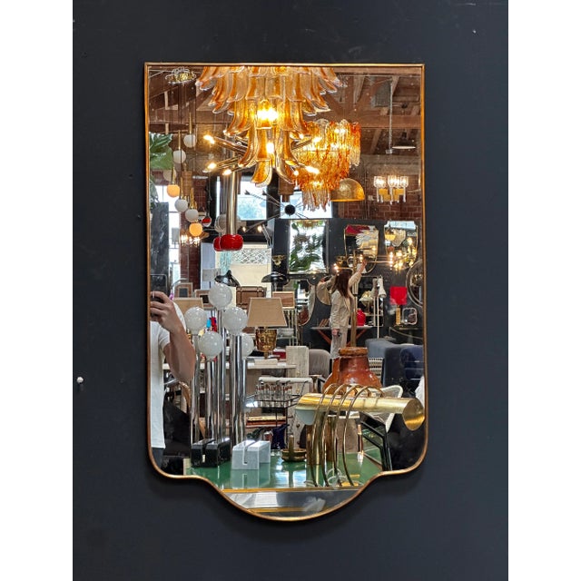 "An exquisite vintage Italian sculptural wall mirror from the 1980s, featuring captivating design and impeccable...