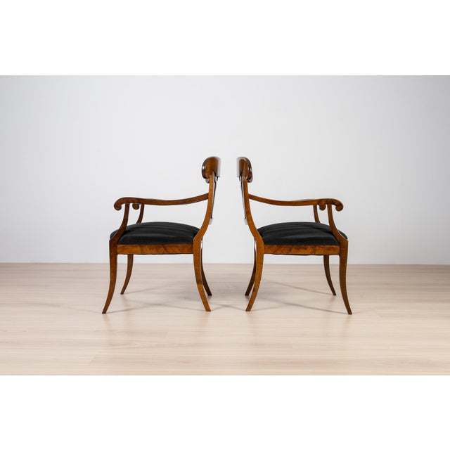 A fine pair of Biedermeier armchairs, crafted in Germany in the first half of the 19th century. The pieces stand out with...