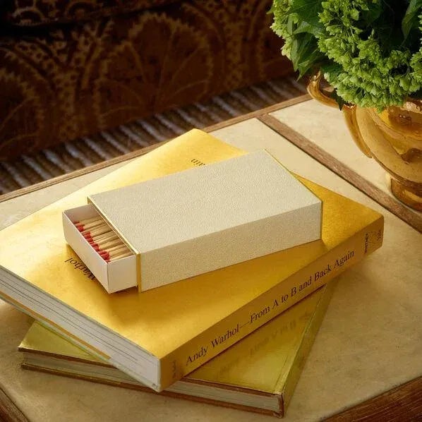 A beautiful faux shagreen box holds oversized matches and includes an opening to reveal the interior strike card. It looks...