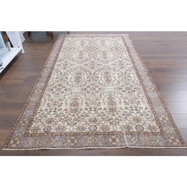 Vintage Turkish Hand-Knotted vintage rug is a semi-antique vintage area rug.'70s Eastern region of Turkey's unique rug is...