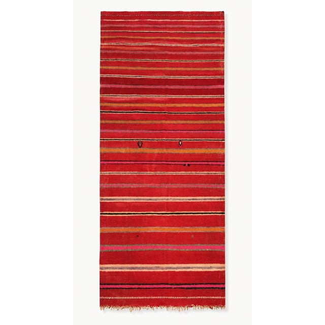 An authentic vintage Moroccan Berber Kilim rug, handwoven in Morocco during the mid-20th century, circa 1960. Measuring 66...