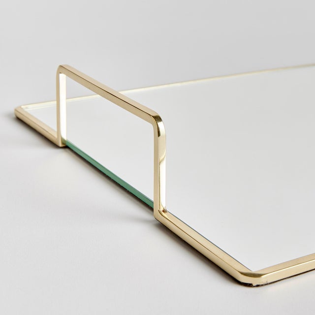 Smooth and streamlined, this mirrored tray is a clean and modern accent. Add to ottoman, side table or even the kitchen...