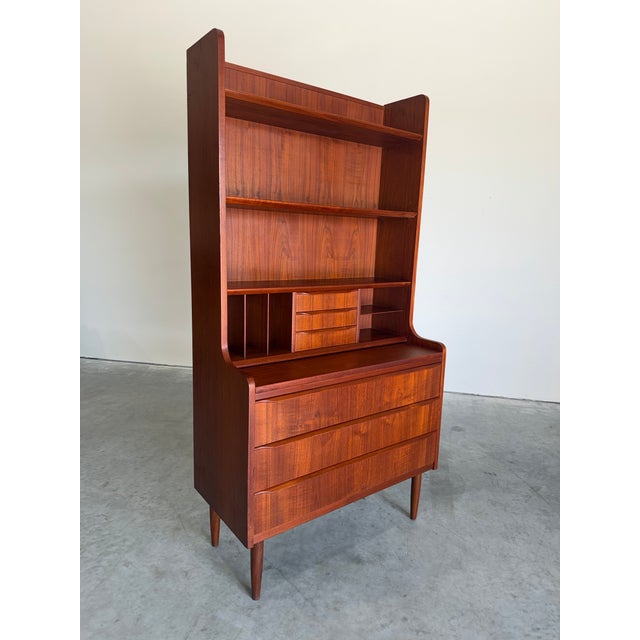 Mid Century Danish Teak Secretary Bookcase c.1960’s. Open shelving, divided cubbies, and 6 drawers, pull out desk surface....