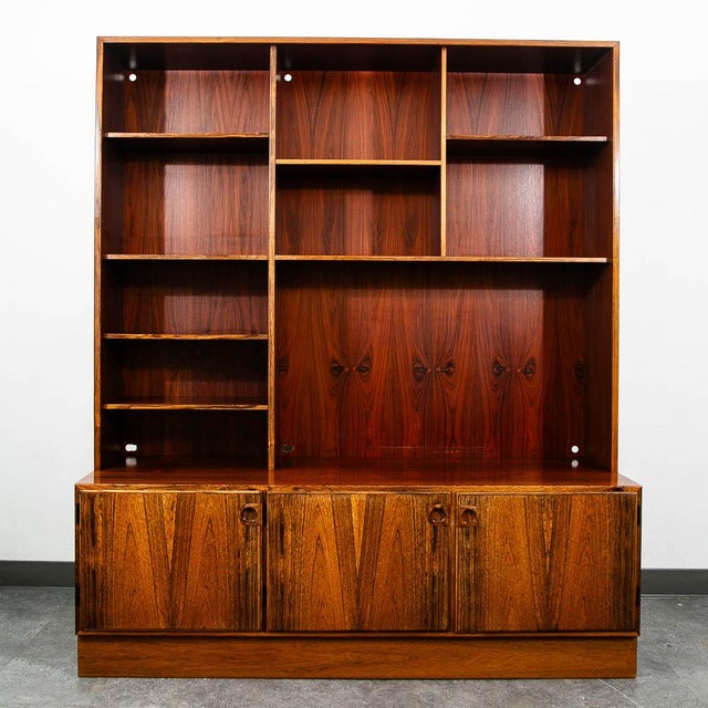 Danish modern two-piece shelving unit it Brazilian rosewood. An excellent media unit that offers ample shelving and a...