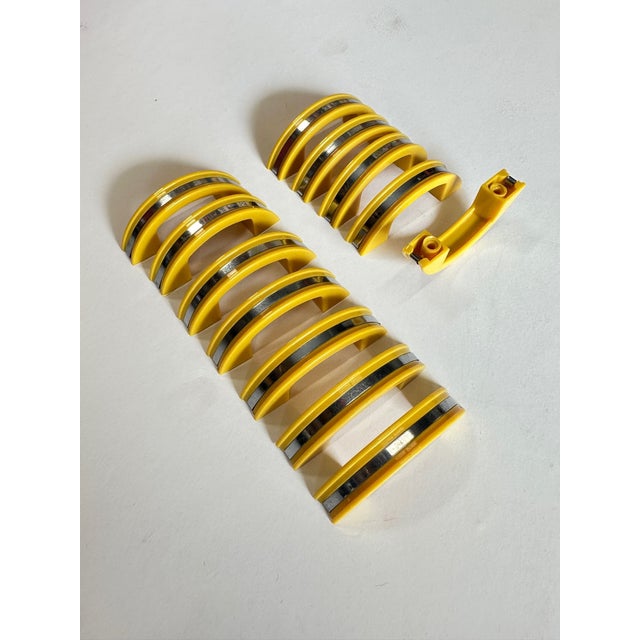 Post-war early yellow phonic resin based plastic pull used for drawers and cabinet doors with a polished aluminum center...