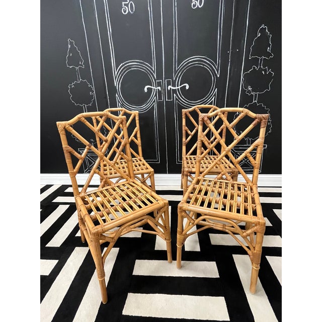Bring timeless elegance and exotic flair to your home with this set of four vintage rattan and bamboo chairs in the...