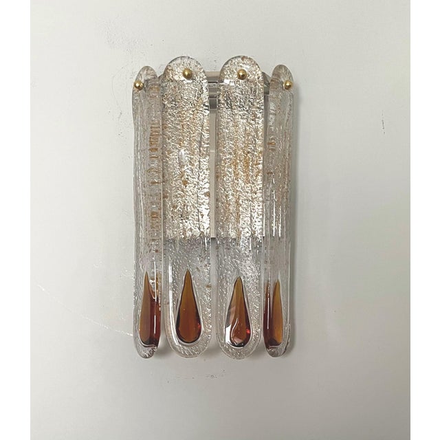 Gorgeous and lovely Pair of Italian dark Amber Murano glass Wall Sconces from 1970s. These fixtures were designed and...