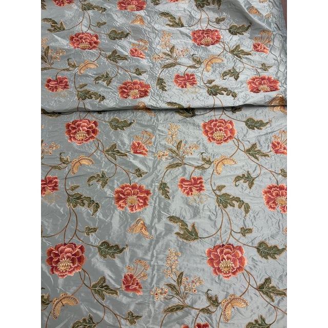 Colefax & Fowler's "Oriental Poppy" in aqua is a silk fabric with stunning viscose embroidery detail featuring a gorgeous...
